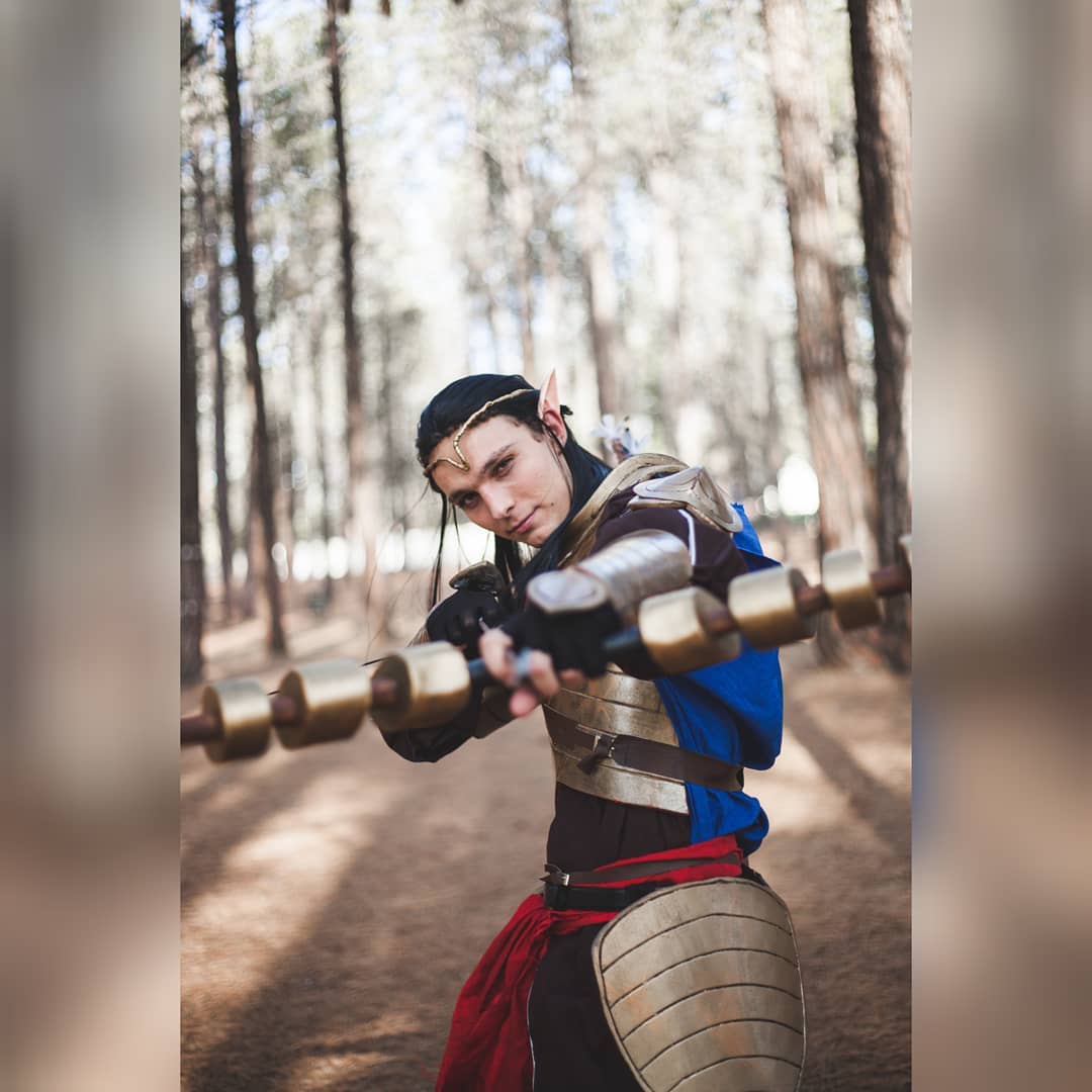 This is an image of Jax Cosplaying Elrond, bow pointed at camera