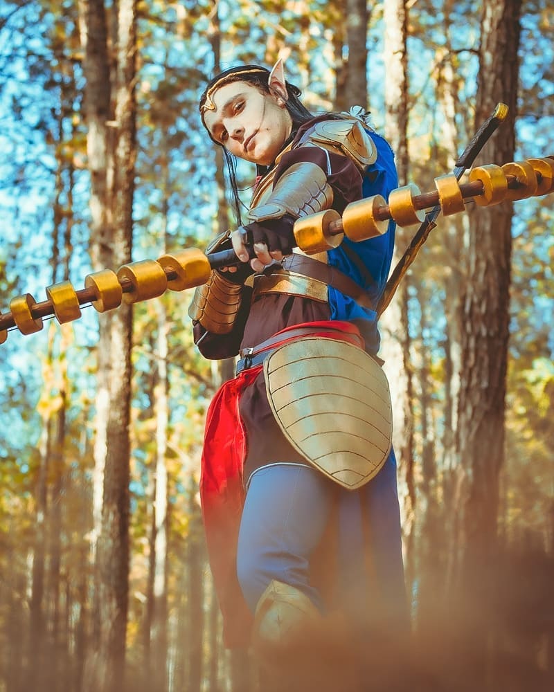 This is an image of Jax Cosplaying Elrond, bow pointed at camera